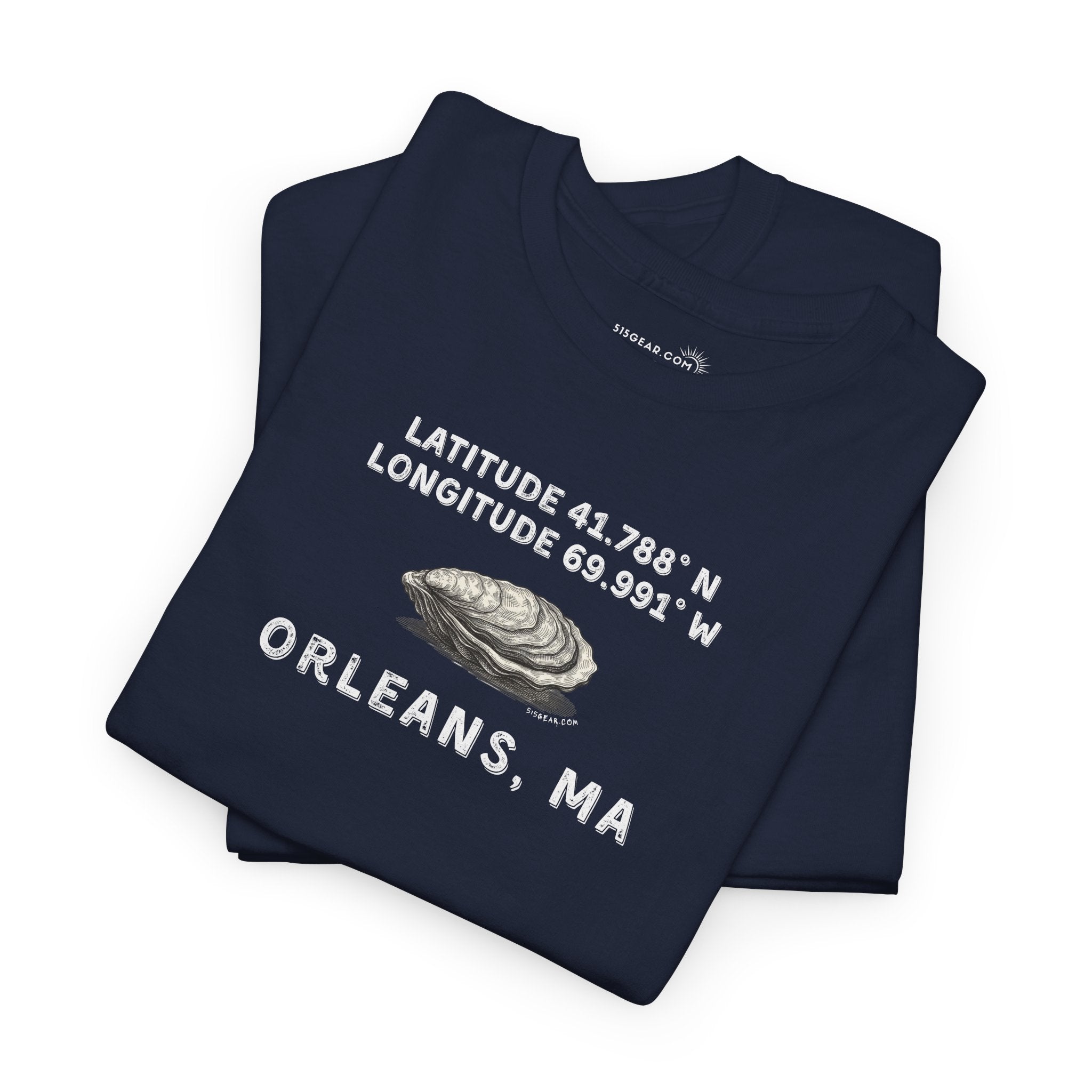 Folded navy blue t-shirt with oyster graphic and rustic text "Latitude 41.788 N, Longitude 69.991 W - Orleans, MA"