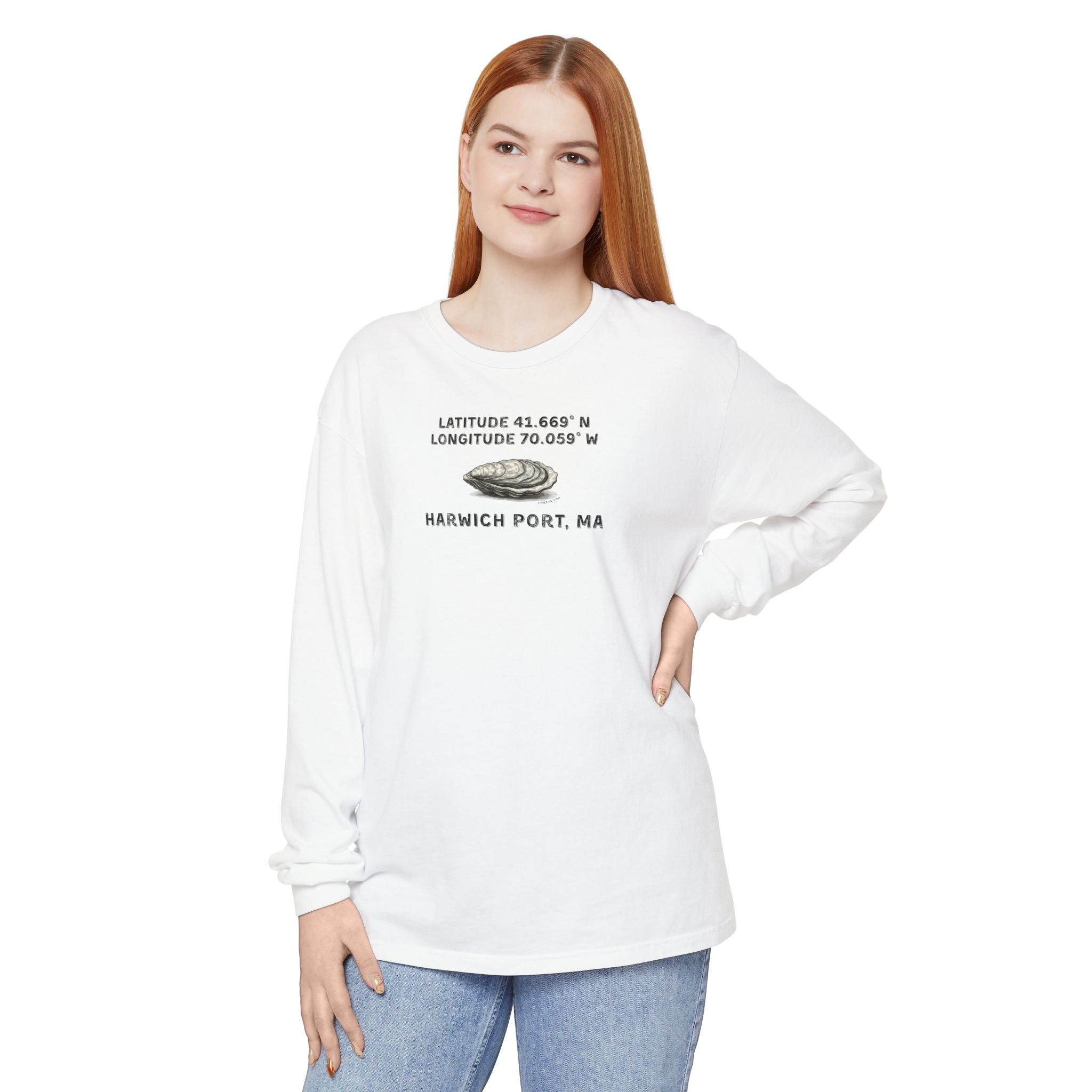 Person wearing a white long-sleeve shirt with text "Latitude 41.669 N Longitude 70.058 W - Harwich Port, MA" and oyster graphic