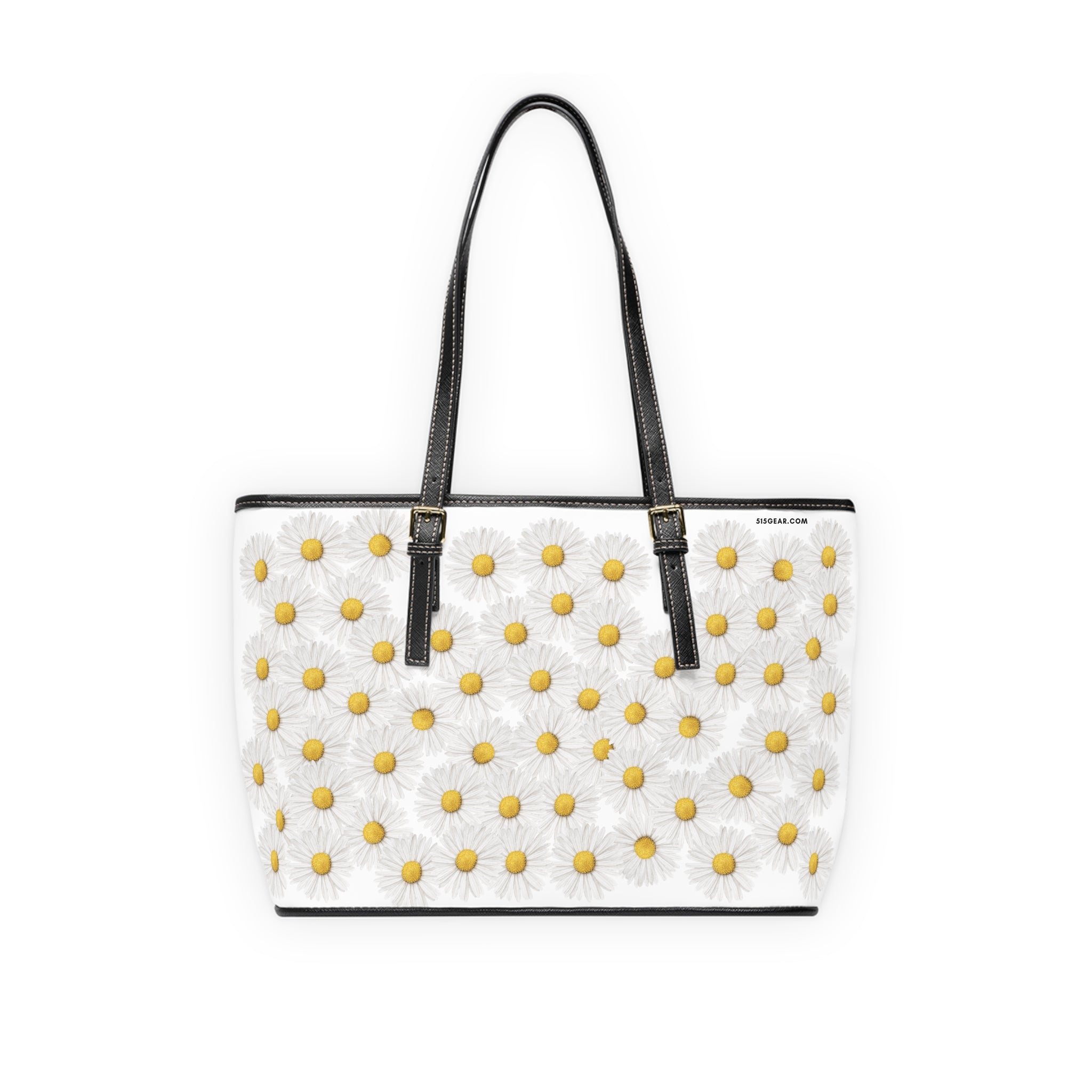 White tote bag with yellow floral daisy pattern and black straps on a white background