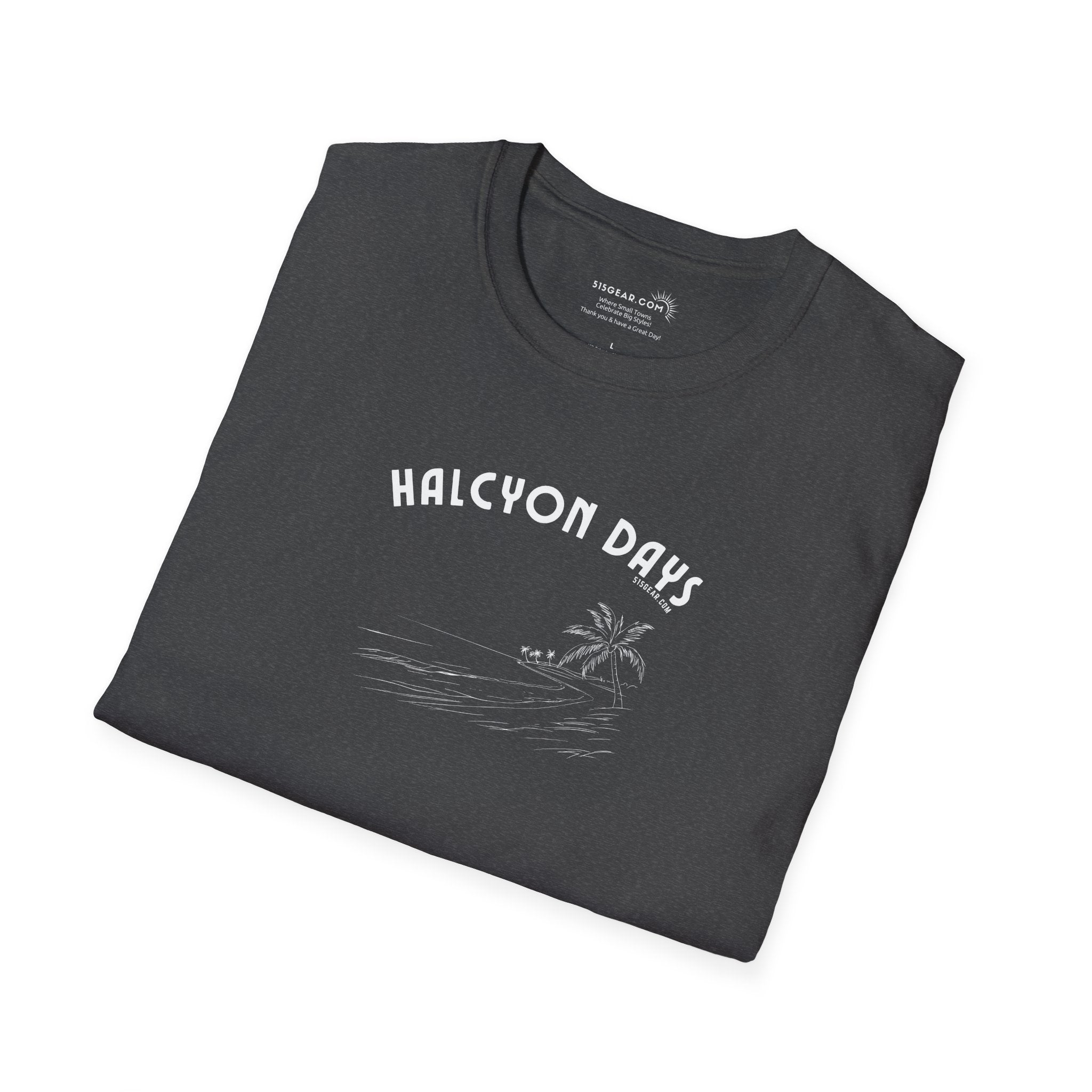 Folded black unisex t-shirt with 'Halcyon Days' text and palm tree beach graphic