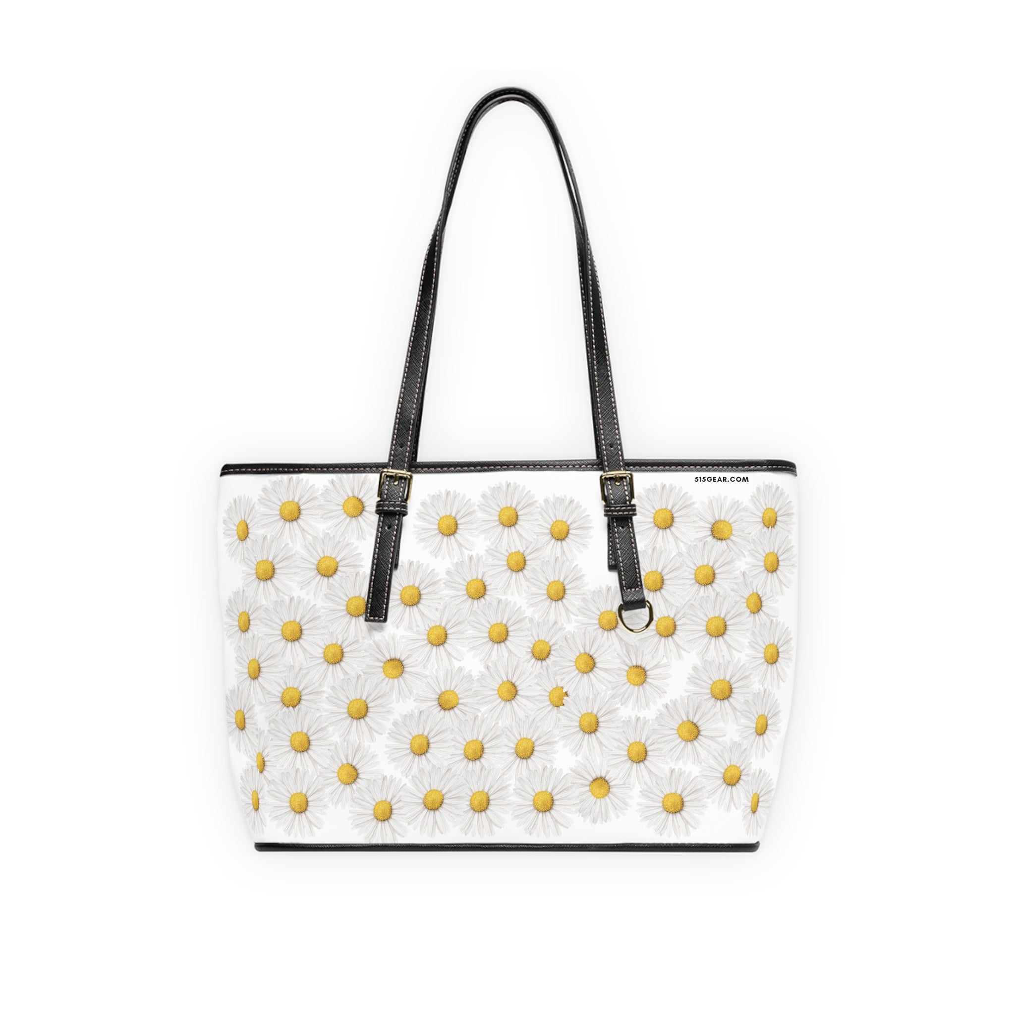 White handbag with yellow floral daisy pattern and black straps on a white background
