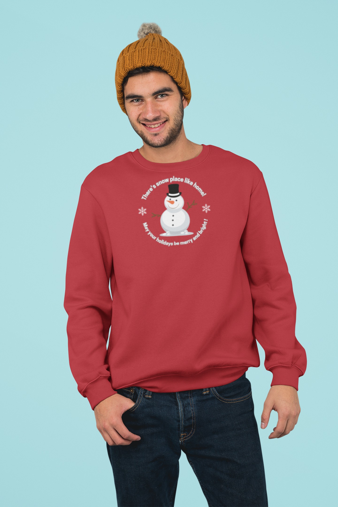 Person wearing a red sweatshirt with a snowman graphic and text saying "There's Snow Place Like Home! May your holidays be merry and bright! by 515Gear.com