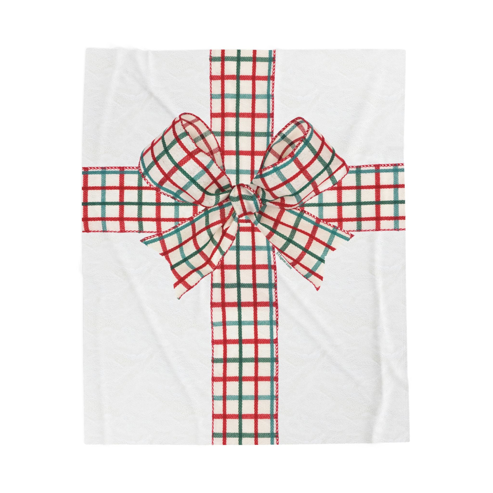 White blanket with a red and green plaid holiday bow graphic on a white background