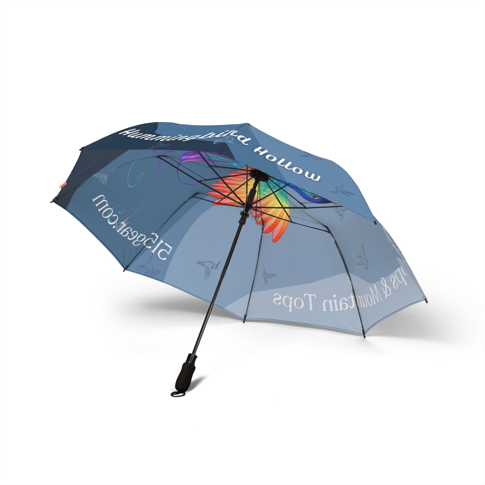 Umbrella with a colorful hummingbird design and text "hummingbird hollow Raindrops & Mountaintops" by 515Gear.com