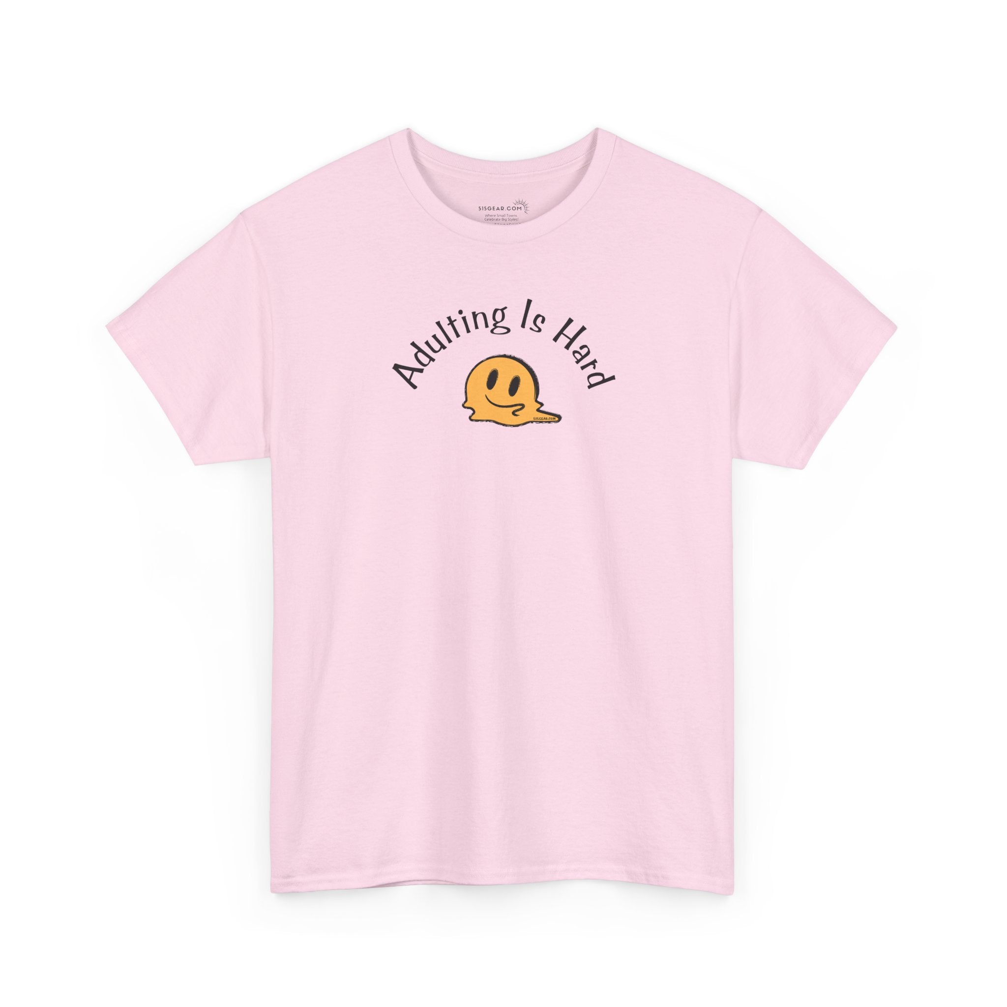 Pink Gildan Unisex 100% Heavy Cotton soft t-shirt, with smiley face graphic and text "Adulting is Hard"