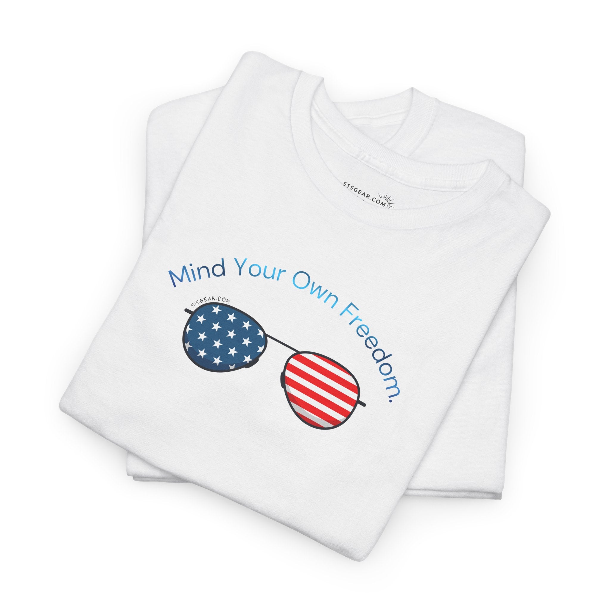 folded White t-shirt with American Flag sunglasses and text "Mind Your Own Freedom"