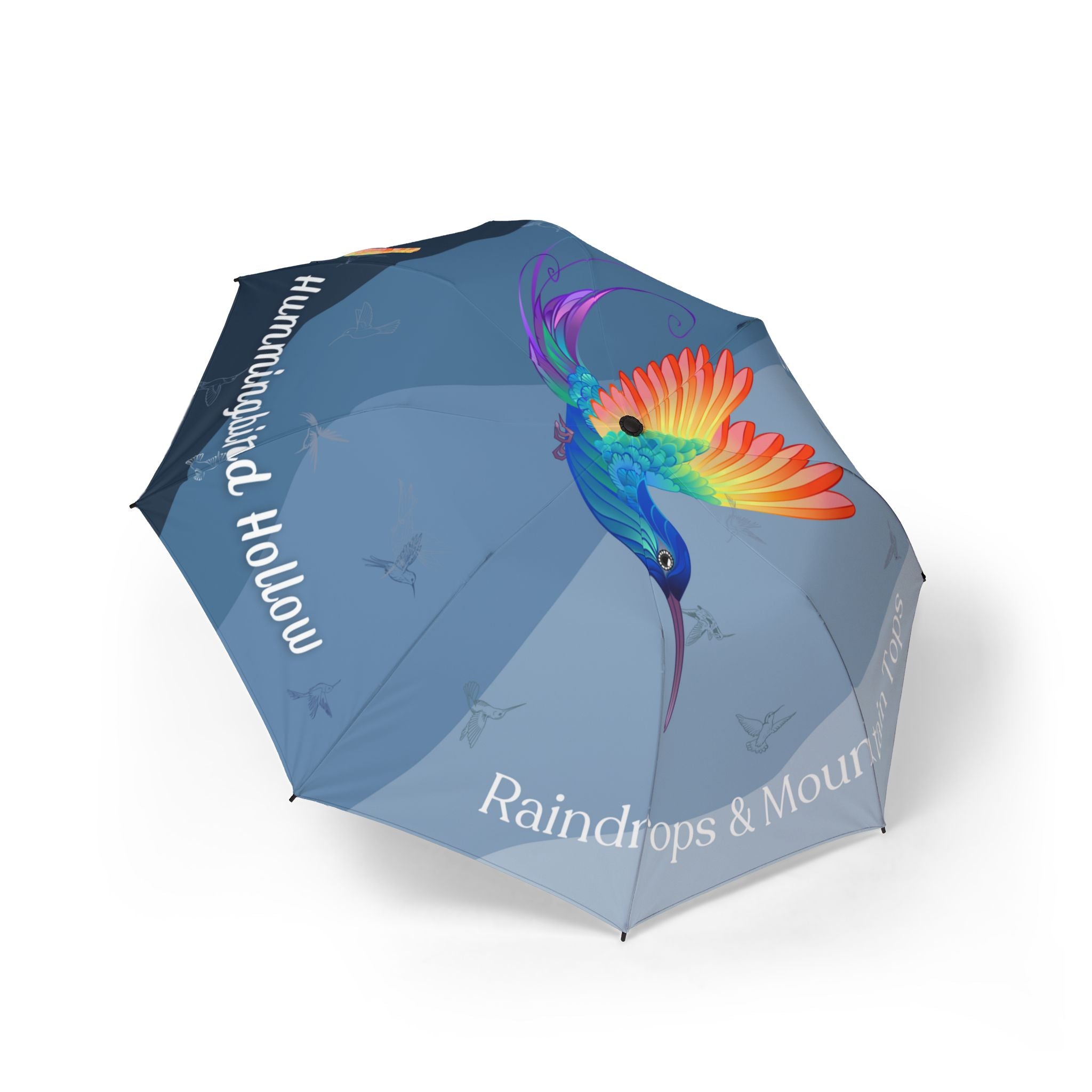Umbrella with a colorful hummingbird design and text "hummingbird hollow Raindrops & Mountaintops" by 515Gear.com