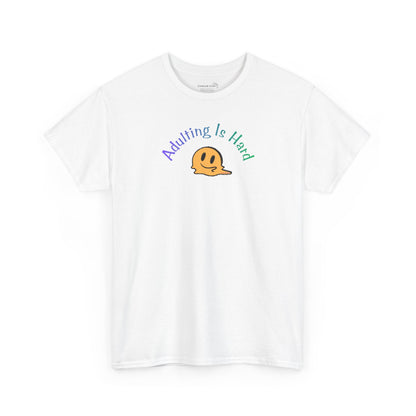 White Gildan Unisex 100% Heavy Cotton soft t-shirt, with smiley face graphic and text "Adulting is Hard"