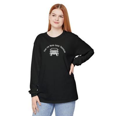 Person wearing a black long-sleeve shirt with a Jeep graphic and text "Take the Road Less Traveled"