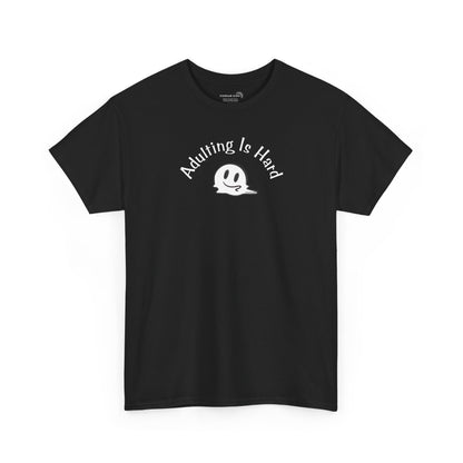 Black Gildan Unisex 100% Heavy Cotton soft t-shirt, with smiley face graphic and text "Adulting is Hard"
