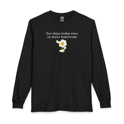 Black long sleeve t-shirt with a sunflower design and text "our steps today echo in their tomorrows"