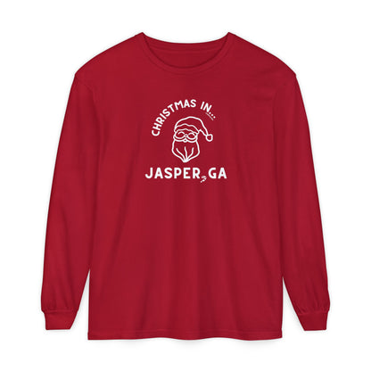 Red long-sleeve shirt with happy Santa and candy cane graphic and text "Christmas in... Jasper, GA"