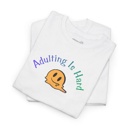 White t-shirt with 'Adulting Is Hard' graphic design on a white background