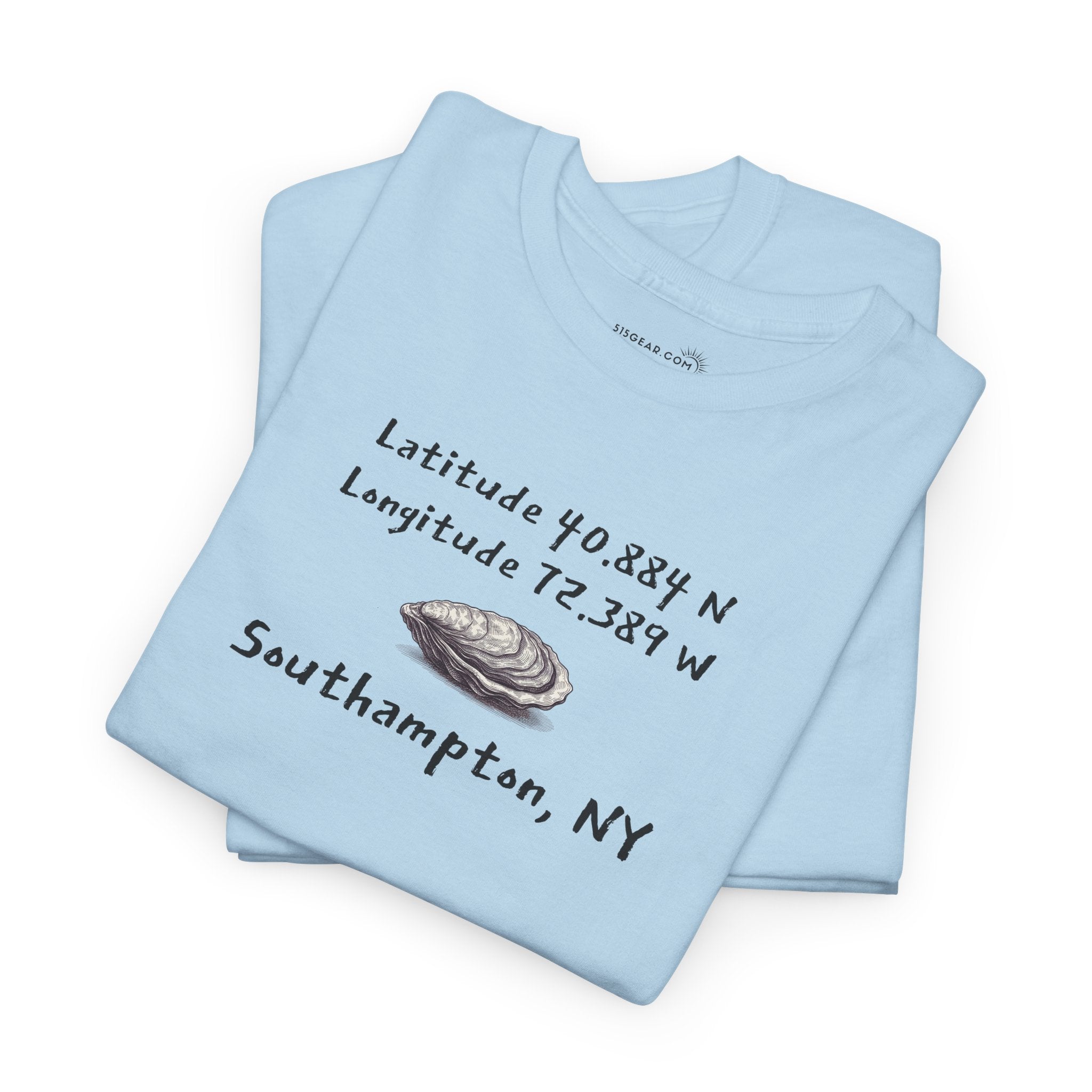 Light blue folded t-shirt with oyster graphic and text "latitude and longitude - Southampton NY"