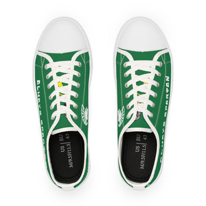Green sneakers with white laces on a white background