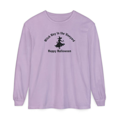 Purple long-sleeve unisex comfort color t-shirt with halloween witch graphic holding a wine glass  and text "Witch Way to the Vineyard - Happy Halloween" 