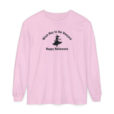 Pink long-sleeve unisex comfort color t-shirt with halloween witch graphic holding a wine glass  and text "Witch Way to the Vineyard - Happy Halloween" 