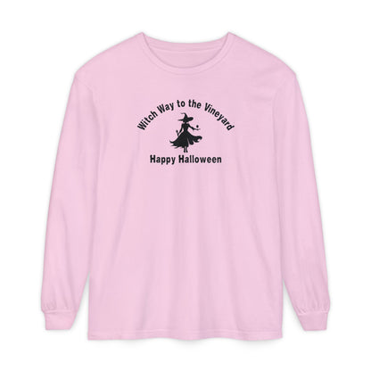 Pink long-sleeve unisex comfort color t-shirt with halloween witch graphic holding a wine glass  and text "Witch Way to the Vineyard - Happy Halloween" 