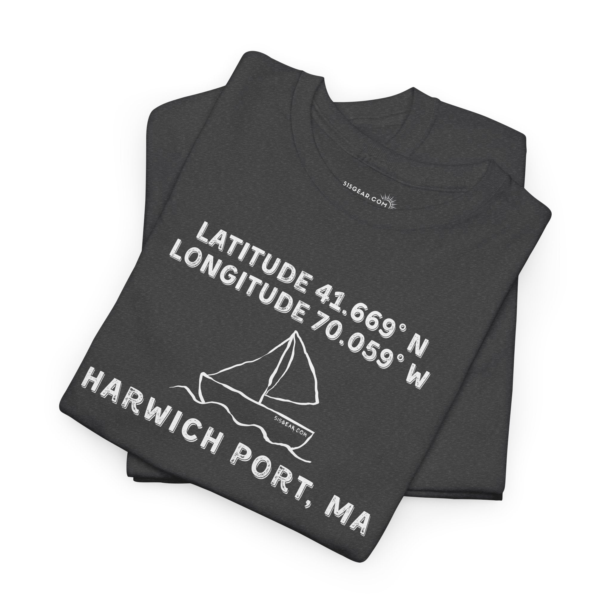 Folded black t-shirt with text "Latitude 41.669 N Longitude 70.058 W - Harwich Port, MA" and sailboat graphic