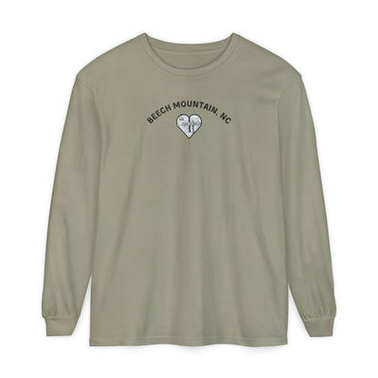 Sage green Comfort Colors® long-sleeve tee with a heart-shaped illustration of Beech Mountain’s slopes, chairlift, and sign pointing to 5506 Skybar 