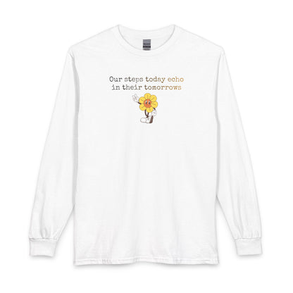 White long sleeve t-shirt with a sunflower design and text "our steps today echo in their tomorrows"