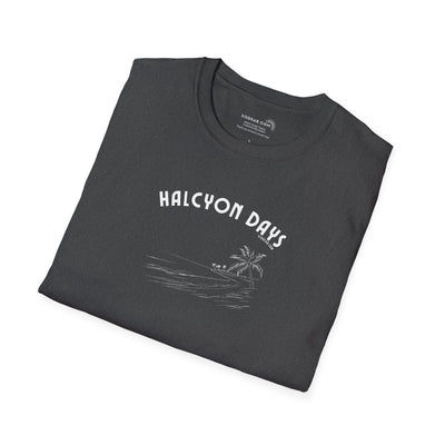 Folded black unisex t-shirt with 'Halcyon Days' text and palm tree beach graphic 