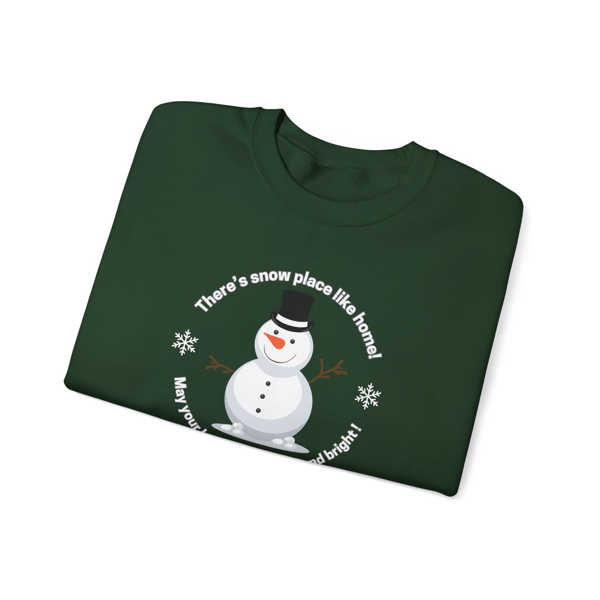 Folded green shirt with a snowman design and text saying There's snow place like home!  May your holidays be merry and bright! by 515Gear.com