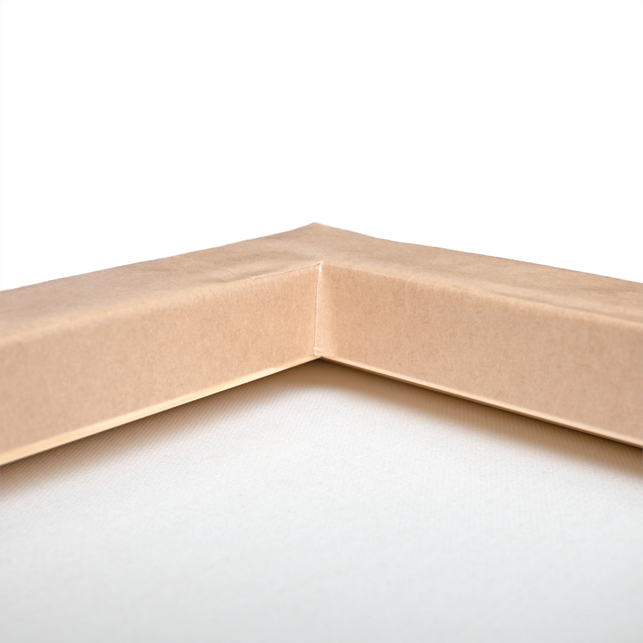 Close-up of a corner of a cardboard box on a white background