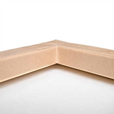 Close-up of a corner of a cardboard box on a white background