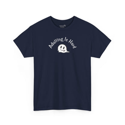 Navy blue Gildan Unisex 100% Heavy Cotton soft t-shirt, with smiley face graphic and text "Adulting is Hard"