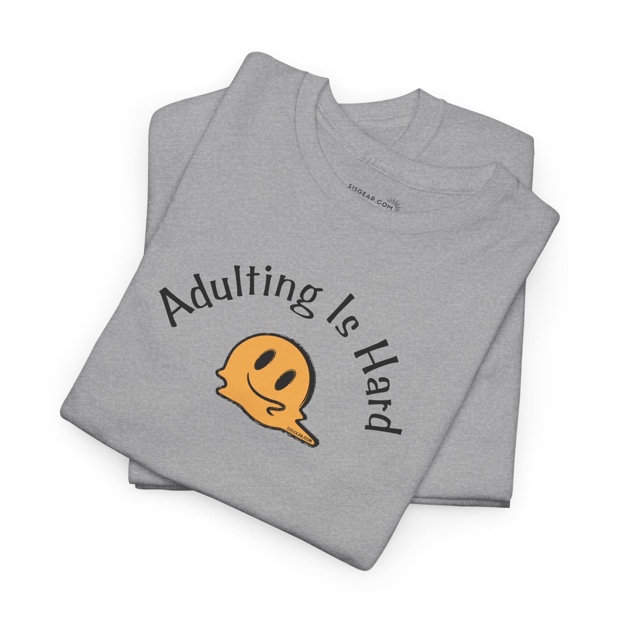 Gray t-shirt with 'Adulting is Hard' text and smiley face on a white background