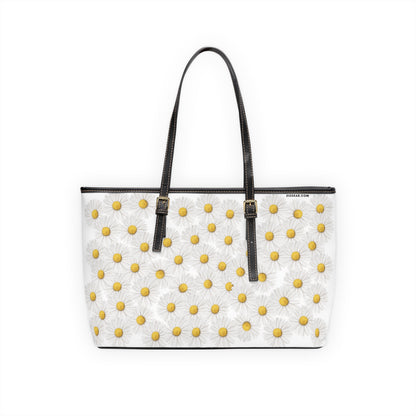 White tote bag with yellow floral daisy pattern on a white background