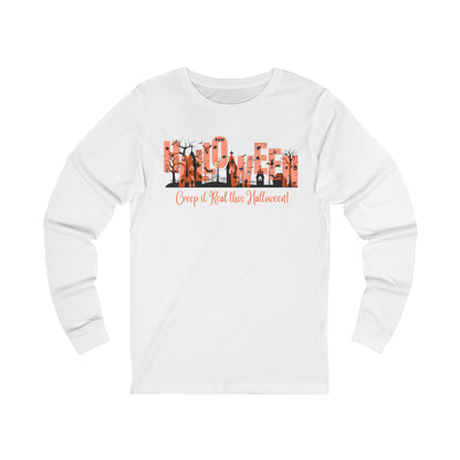 white unisex long sleeve t-shirt with halloween graphic of a cemetery and larger text "Halloween" and small text "Creep It Real This Halloween" by 515Gear.com 