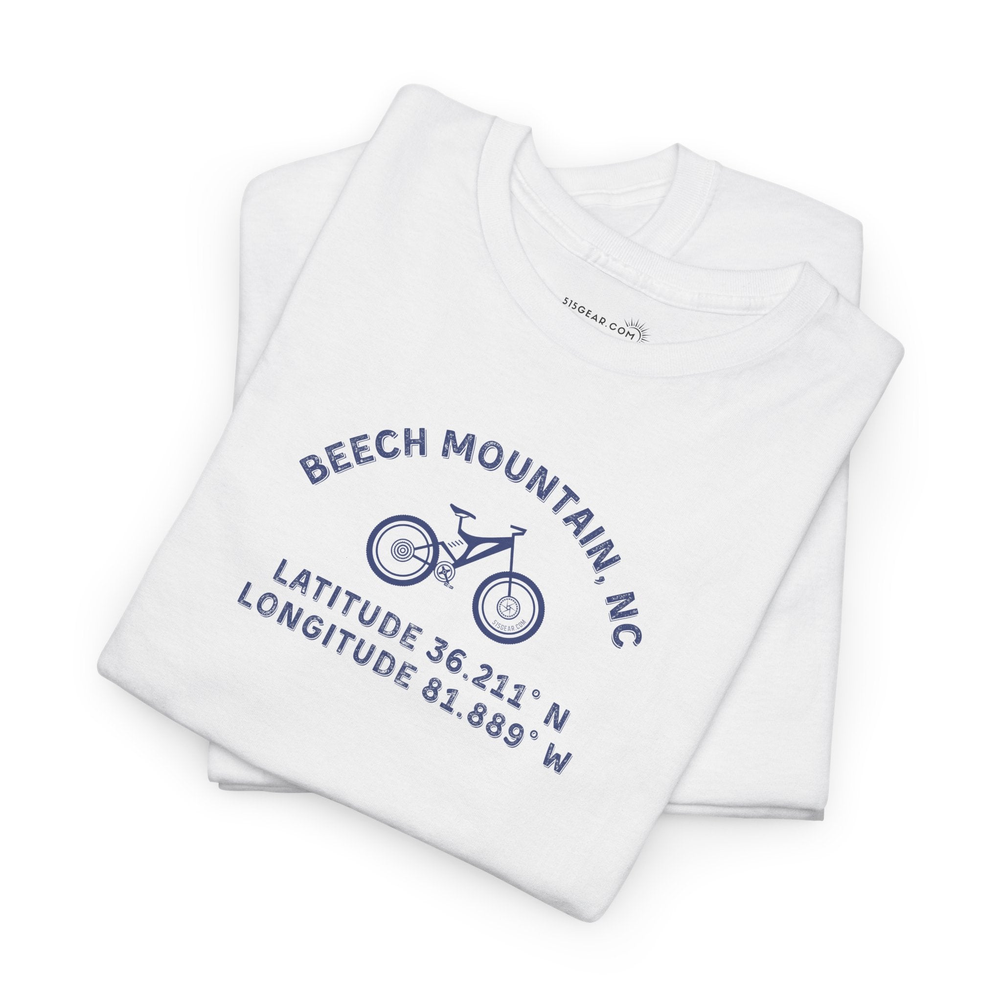 folded White t-shirt with mountain bike graphic and text "Beech Mountain, NC - Latitude and Longitude" coordinates