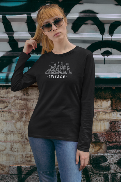 Woman wearing a black long-sleeve shirt with Chicago skyline design against and text "Chicago"
