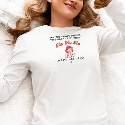 Person wearing a white long sleeve t-shirt with a humorous graphic and text "my therapist told me to embrace my inner Ho Ho Ho - Happy Holidays"