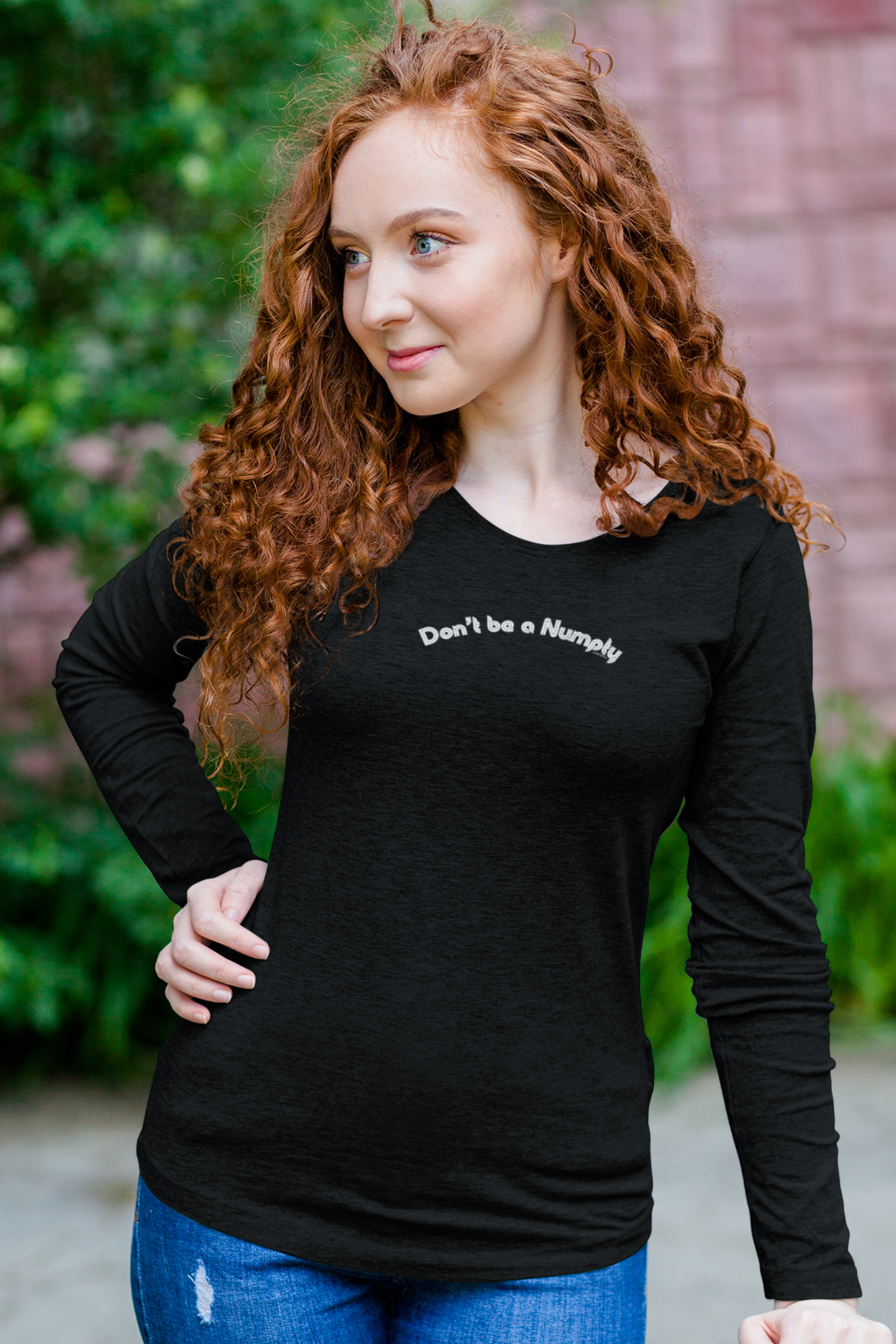Woman wearing a black long-sleeve shirt with text "Don't be a Numpty"