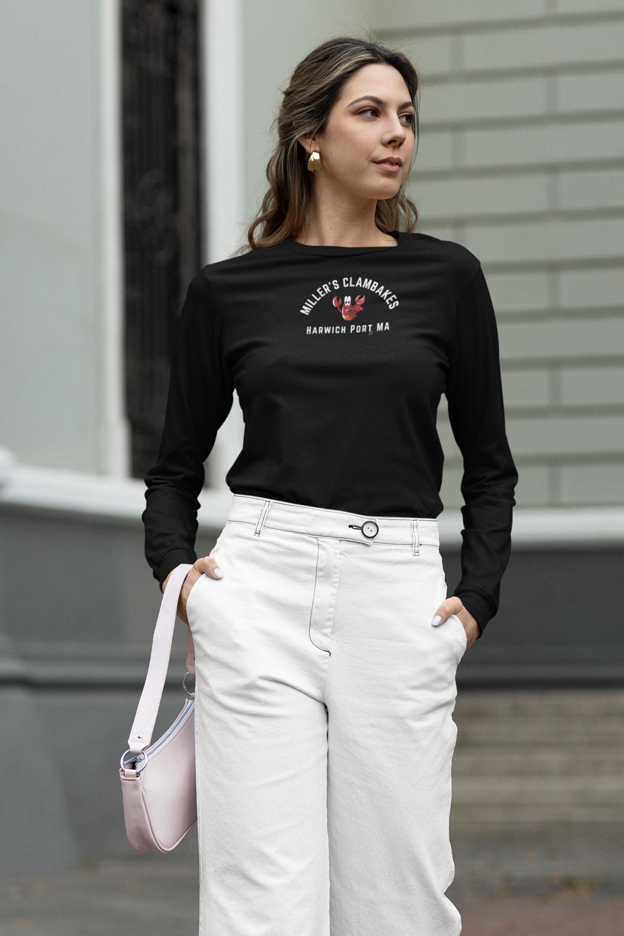 Woman wearing a black long-sleeve shirt with happy lobster graphic and text "Miller's Clambakes Harwich Port, MA"