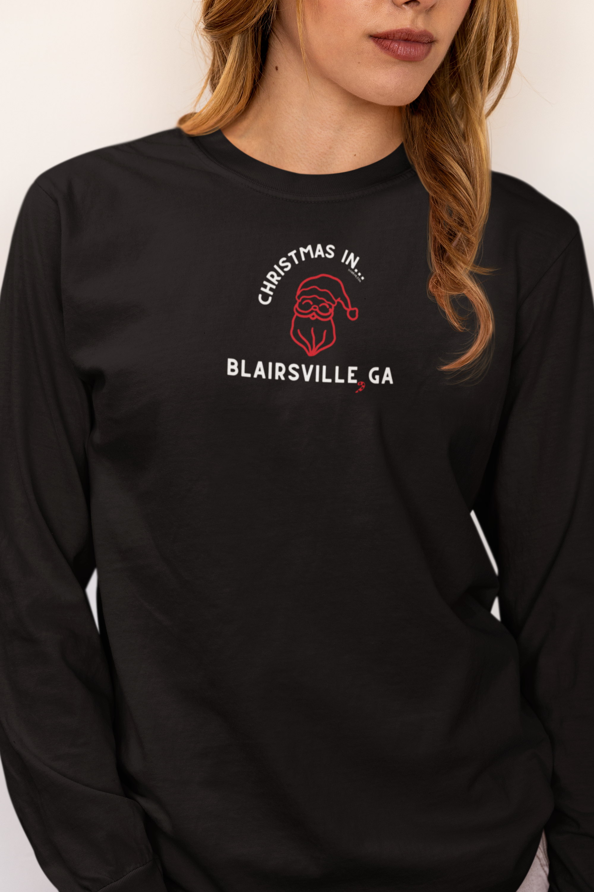 Black long-sleeve Comfort Colors t-shirt with Santa graphic and text "Christmas in Blairsville, GA"
