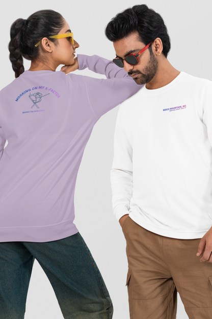 Two people wearing long-sleeve Comfort Color tees with ski jump - iron cross - graphic and text Beech Mountain NC