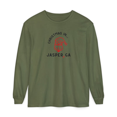 Green long-sleeve shirt with happy Santa and candy cane graphic and text "Christmas in... Jasper, GA"