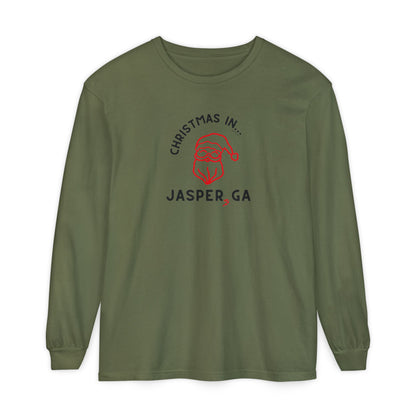 Green long-sleeve shirt with happy Santa and candy cane graphic and text "Christmas in... Jasper, GA"