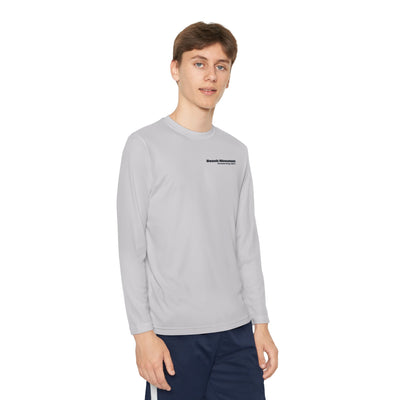 Person wearing a gray long-sleeve performance tee with text "Beech Mountain, Vertical Drop: 830 ft" on the front