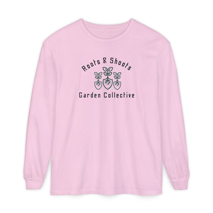 Pink long-sleeve shirt with 'Roots & Shoots Garden Collective' logo on a white background