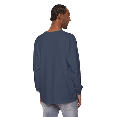 Man wearing a plain blue long-sleeve shirt on a white background