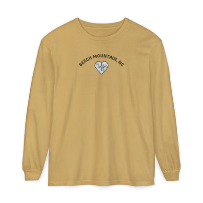Mustard Comfort Colors® long-sleeve tee with a heart-shaped illustration of Beech Mountain’s slopes, chairlift, and sign pointing to 5506 Skybar 