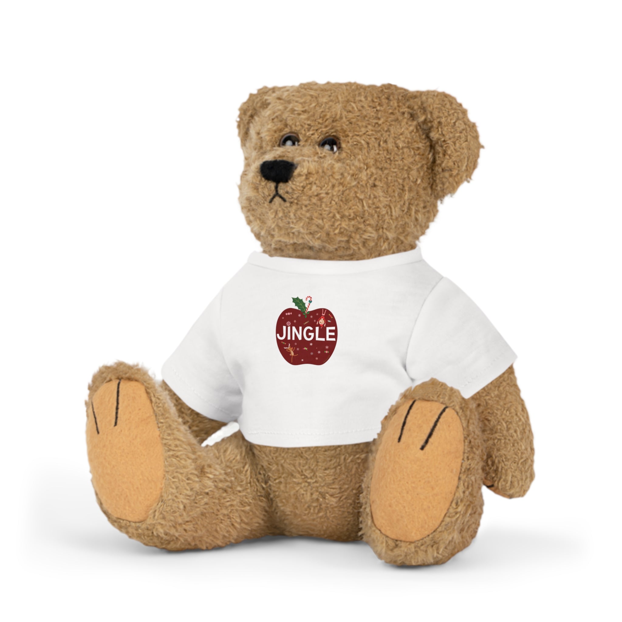 Teddy bear wearing a white shirt with a red apple graphic and 'JINGLE' text on a white background