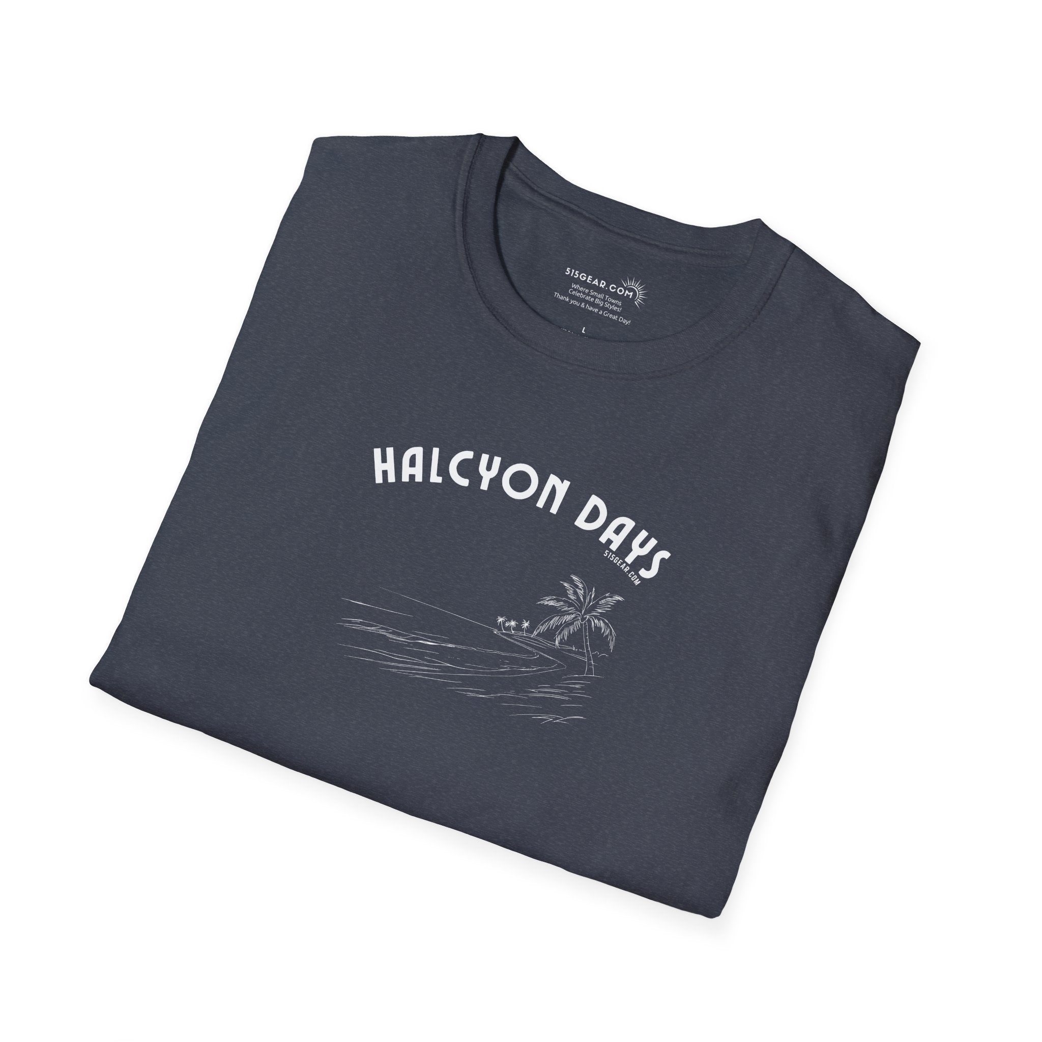 Folded dark gray t-shirt with 'Halcyon Days' text and palm tree graphic on a white background