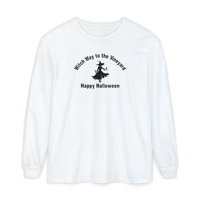 White long-sleeve unisex comfort color t-shirt with halloween witch graphic holding a wine glass  and text "Witch Way to the Vineyard - Happy Halloween" 
