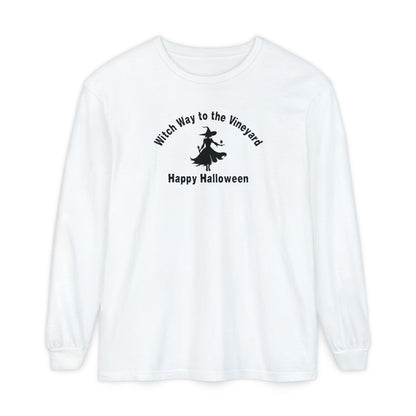 White long-sleeve unisex comfort color t-shirt with halloween witch graphic holding a wine glass  and text "Witch Way to the Vineyard - Happy Halloween" 